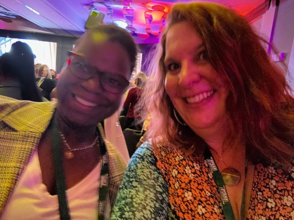 Dr. Abigail Joseph and Dr. Sarah Jefferis in front of stage smiling together