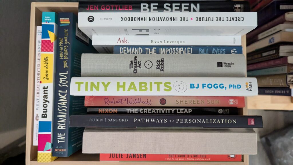 Creativity and innovation books stacked in a box