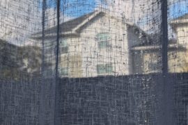 rain drops on porch curtain look through to buildings