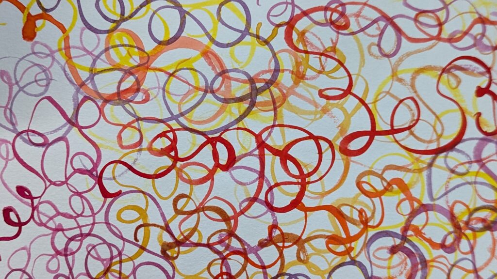 Colorful wavy tangled lines in red, yellow, purple