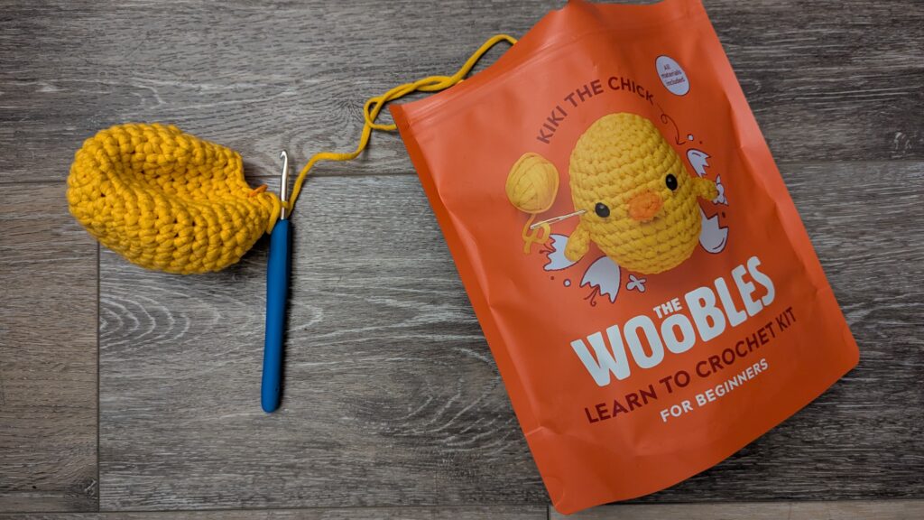 Wobbles particially crocheted chick with yellow yarn