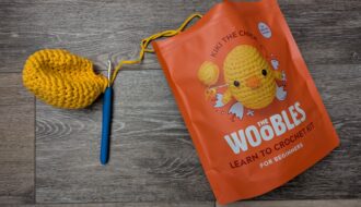 Wobbles particially crocheted chick with yellow yarn