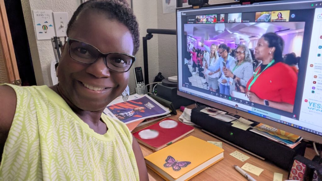 Dr Abigail working at her desk with Zoom window open to Speak & Write 2025
